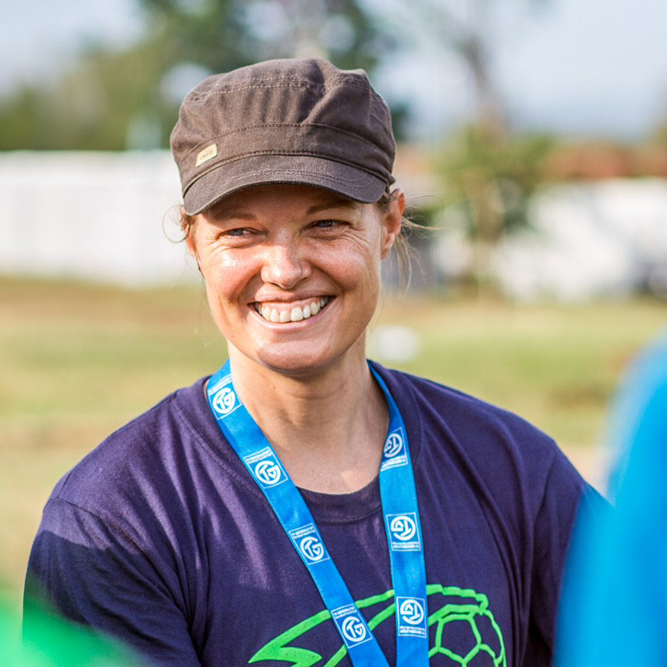 Profile picture of Nicola Scholl from COACH ABROAD smiling during a sports event.