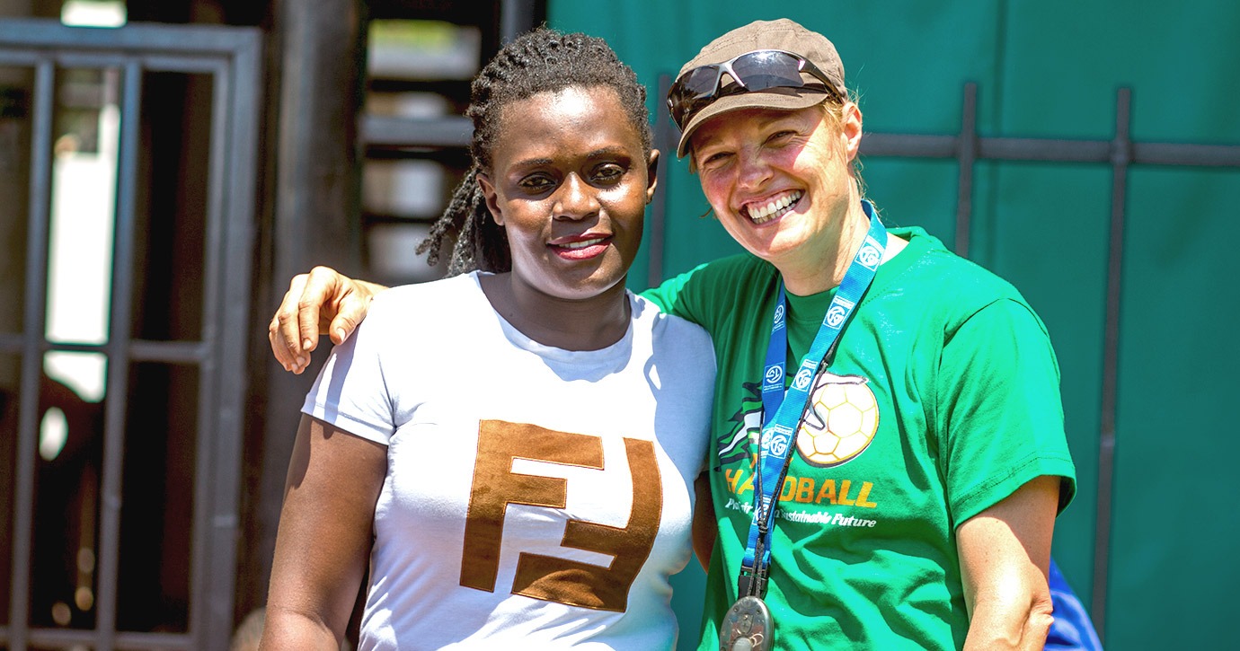 COACH ABROAD's Nicola Scholl smiles for the camera with a project partner in South Africa.